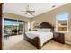 Main bedroom with king-size bed and water view at 5933 Lake Victoria Dr, Lakeland, FL 33813