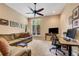 Home office with desk, comfortable seating, and ceiling fan at 5933 Lake Victoria Dr, Lakeland, FL 33813
