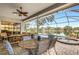 Outdoor patio furniture with view of pool and lake at 5933 Lake Victoria Dr, Lakeland, FL 33813