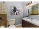 Cozy bathroom featuring a modern vanity, a toilet, and a tiled shower at 1305 Avenue S Nw, Winter Haven, FL 33881