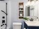 Bathroom features custom shelving, modern fixtures, and stylish design at 1305 Avenue S Nw, Winter Haven, FL 33881