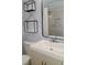 Modern bathroom with a white vanity and a frameless mirror at 1305 Avenue S Nw, Winter Haven, FL 33881