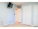 Spacious bedroom with wood floors and TV at 1305 Avenue S Nw, Winter Haven, FL 33881