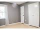 Spacious bedroom with gray walls and laminate wood floors at 1305 Avenue S Nw, Winter Haven, FL 33881