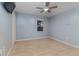Bedroom with wood floors, ceiling fan, and natural light at 1305 Avenue S Nw, Winter Haven, FL 33881