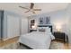 Serene bedroom featuring wood floors, ceiling fan, and stylish nightstands at 1305 Avenue S Nw, Winter Haven, FL 33881