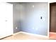 Bedroom with gray walls, wood floors, and double closets at 1305 Avenue S Nw, Winter Haven, FL 33881