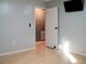 Bright bedroom with wood-look floors and access to bathroom at 1305 Avenue S Nw, Winter Haven, FL 33881