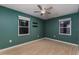 Bedroom with wood floors, natural light, and green walls at 1305 Avenue S Nw, Winter Haven, FL 33881