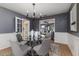 Dining room featuring a round table with backyard view and open to the living room and kitchen at 1305 Avenue S Nw, Winter Haven, FL 33881
