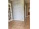 Whitewashed brick accent wall in the entryway at 1305 Avenue S Nw, Winter Haven, FL 33881