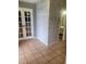 View of entryway with whitewashed brick and double doors at 1305 Avenue S Nw, Winter Haven, FL 33881