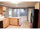 Kitchen features wood cabinets and a breakfast bar at 1305 Avenue S Nw, Winter Haven, FL 33881