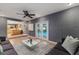 Cozy living room with seamless access to the backyard pool area through glass doors at 1305 Avenue S Nw, Winter Haven, FL 33881