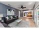 Open living space leading into the kitchen, featuring tile floors and modern decor at 1305 Avenue S Nw, Winter Haven, FL 33881