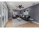Well-decorated living room featuring contemporary furniture, stylish lighting, and neutral tones at 1305 Avenue S Nw, Winter Haven, FL 33881