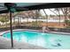 Inviting screened pool with waterfall feature at 1305 Avenue S Nw, Winter Haven, FL 33881