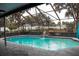 Inviting screened pool with waterfall feature at 1305 Avenue S Nw, Winter Haven, FL 33881