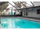 Spacious pool area with covered patio at 1305 Avenue S Nw, Winter Haven, FL 33881