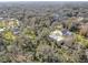 Aerial view of a home on a large lot with mature trees and lush landscape at 3940 Laurel Branch Dr, Lakeland, FL 33810