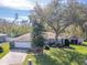 Single-story home with mature landscaping and driveway at 3940 Laurel Branch Dr, Lakeland, FL 33810