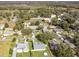 Aerial view of a suburban neighborhood with houses and tree-lined streets at 3940 Laurel Branch Dr, Lakeland, FL 33810