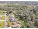 Aerial view showing a neighborhood with houses, yards, and a pool at 3940 Laurel Branch Dr, Lakeland, FL 33810