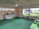Bright Florida room with green carpeting and lattice ceiling at 3940 Laurel Branch Dr, Lakeland, FL 33810