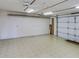 Garage with pegboard walls and tiled floor at 3940 Laurel Branch Dr, Lakeland, FL 33810