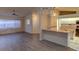 Living room and kitchen with laminate flooring and breakfast bar at 3940 Laurel Branch Dr, Lakeland, FL 33810