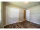 Bedroom featuring wood flooring and a closet at 5058 Cimarron Dr, Lakeland, FL 33813