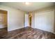 Bedroom featuring wood flooring and a closet and view to the bathroom at 5058 Cimarron Dr, Lakeland, FL 33813