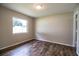 Bedroom featuring wood flooring and a neutral color scheme at 5058 Cimarron Dr, Lakeland, FL 33813