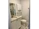 Updated bathroom with white cabinets and granite countertop at 520 Green Cir, Fort Meade, FL 33841