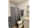 Bathroom with gray shower curtain and white vanity at 520 Green Cir, Fort Meade, FL 33841