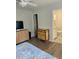 Bright bedroom with a dresser, TV, and en-suite bathroom at 520 Green Cir, Fort Meade, FL 33841
