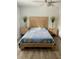 Bedroom with light wood bed frame and blue bedding at 520 Green Cir, Fort Meade, FL 33841