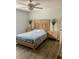 Spacious bedroom with a queen bed and light wood furniture at 520 Green Cir, Fort Meade, FL 33841