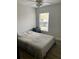 Bedroom with gray bedding and wood floors at 520 Green Cir, Fort Meade, FL 33841