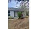 Front view of a cozy gray house with a covered porch at 520 Green Cir, Fort Meade, FL 33841