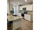 Updated kitchen featuring granite countertops and white cabinets at 520 Green Cir, Fort Meade, FL 33841