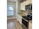 Eat-in kitchen with granite countertops and modern appliances at 520 Green Cir, Fort Meade, FL 33841