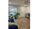 Bright living room with blue sofa and coastal decor at 520 Green Cir, Fort Meade, FL 33841