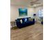 Living room featuring blue sofa and coastal decor at 520 Green Cir, Fort Meade, FL 33841