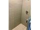 Clean shower with gray tile and pebble floor at 520 Green Cir, Fort Meade, FL 33841