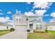 Charming two-story home with a well-manicured lawn and attached two car garage at 5460 Siltstone St, Lakeland, FL 33811