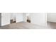 The bedroom has neutral carpeting, white walls, and multiple doors leading to various rooms at 565 Sw 77Th Cir, Ocala, FL 34474