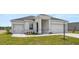 Beautiful single-Gathering home with a two-car garage, tidy landscaping, and a gray roof at 565 Sw 77Th Cir, Ocala, FL 34474