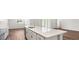Modern kitchen featuring quartz countertops, stainless appliances, a center island and an eat-in breakfast area at 565 Sw 77Th Cir, Ocala, FL 34474