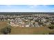 Wide shot of a residential neighborhood with a variety of homes and landscaping at 8183 Westmont Terrace Dr, Lakeland, FL 33810